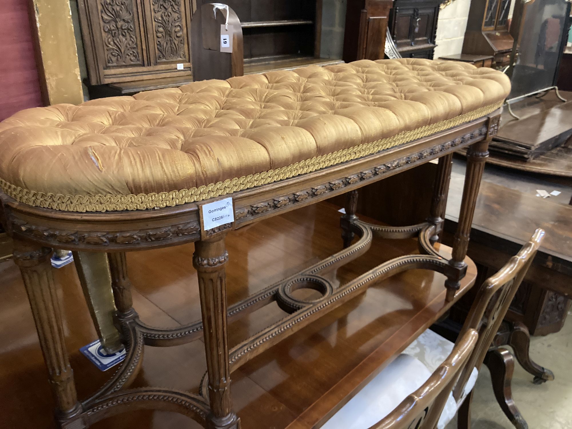 A French dressing stool, length 100cm, depth 38cm, height 52cm together with a Victorian adjustable piano stool
